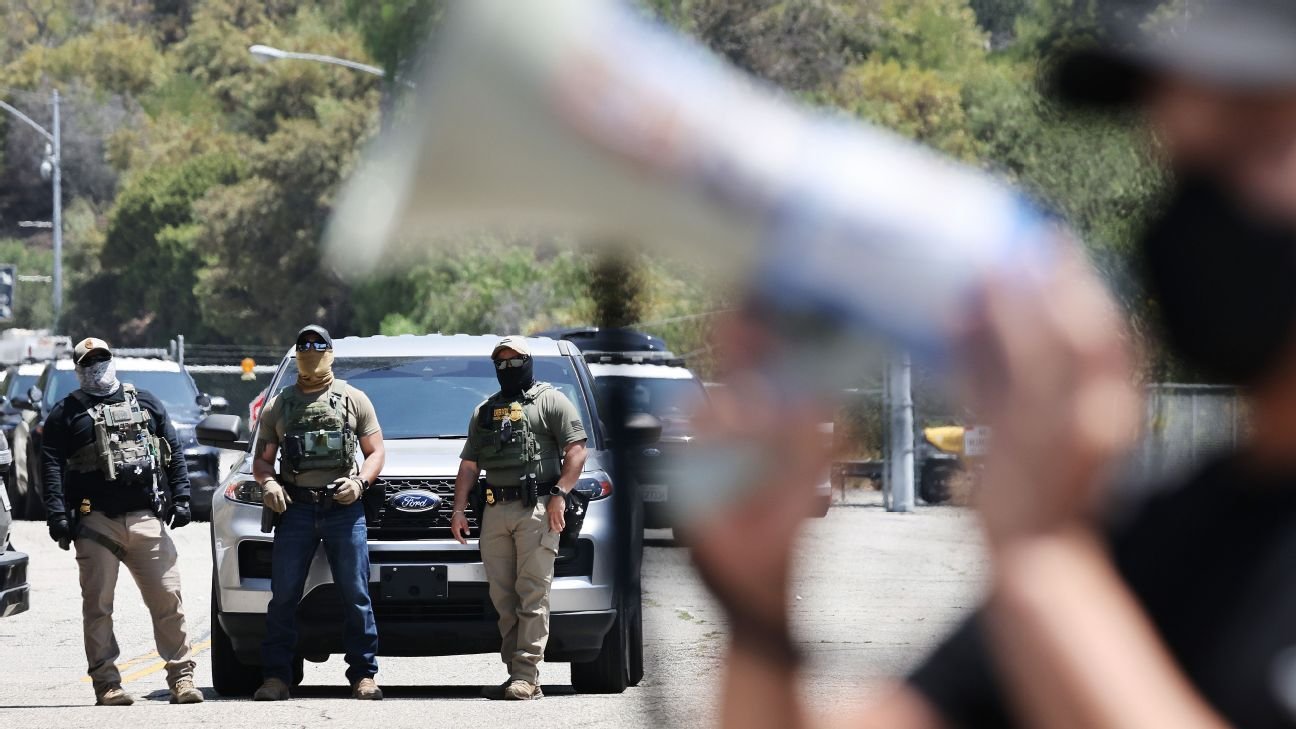Dodgers say they asked federal agents to leave parking lot