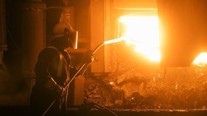 An employee prepares to take a sample from the electric arc furnace at Liberty Steel’s Aldwarke mill in Rotherham