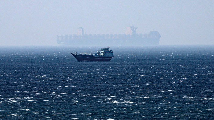 A ship sails in the Strait of Hormuz as seen from Khasab, Musandam Governorate, Oman on Tuesday
